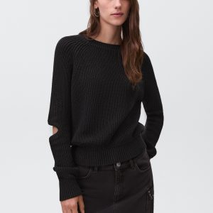 Knitted sweater with openings