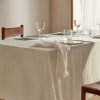 Linen tablecloth with frayed ends for 6 to 8 diners