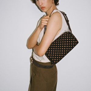 Suede shoulder bag with eyelets