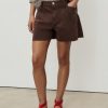 Denim shorts with frayed hem and pleats