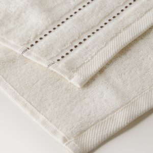 Cotton guest towel with embroidered dots