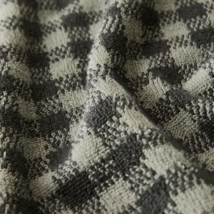 Cotton check-print guest towel with overlock stitching