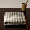 Cotton check-print washbasin towel with overlock stitching