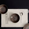 Cotton placemat made from piqué-textured cotton fabric