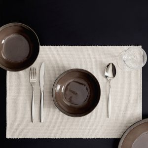Cotton placemat made from piqué-textured cotton fabric