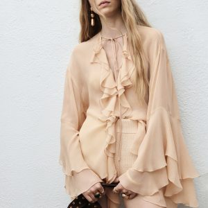Ruffled blouse with flared sleeves