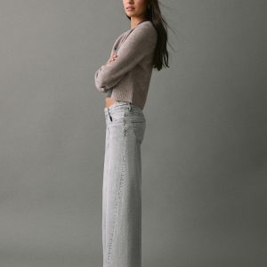 Low-waist studded jeans