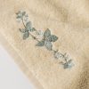 Guest towel with embroidered flower