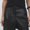 Skin-effect pleated shorts