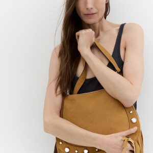 Suede bag with fringes and stud details