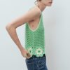 Crochet top with floral finishes