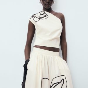 Asymmetrical flower-embroidered top