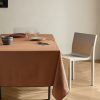 Resin-coated cotton tablecloth with overlock stitching for 6 to 8 diners