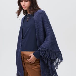 Knitted poncho with tassels