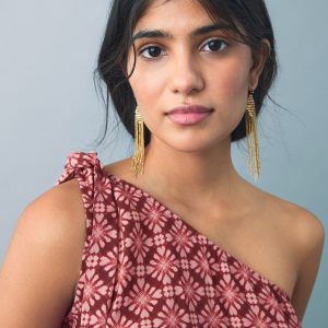 Asymmetrical blouse with bow at the neck