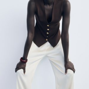 Vest with jewel buttons