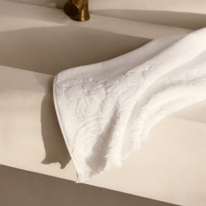 Washbasin towel with floral trim
