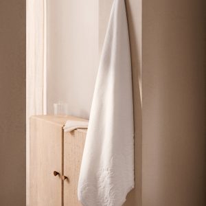 Bath towel with floral trim