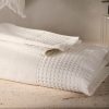 Bath towel with waffle trim and fringe