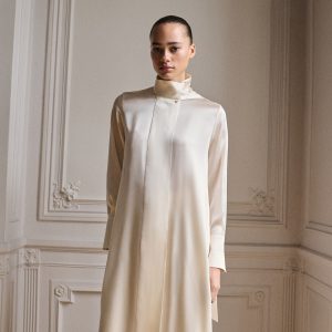 Cape-style silk dress with bow neck