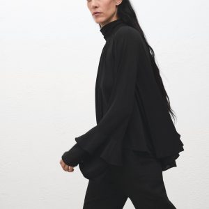 Blouse with flared sleeves and ruffles